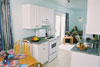 kitchen and dining and living room in the two bedroom unit at the New Horizon Motel